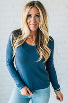 Blonde Woman Wearing A Solid Washed Basic Scoop Neck Ribbed Tee.