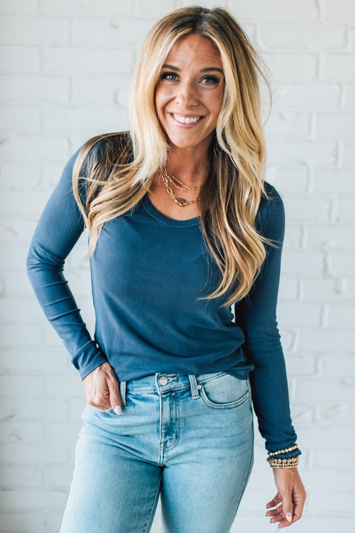Blonde Woman Wearing A Solid Washed Basic Scoop Neck Ribbed Tee.