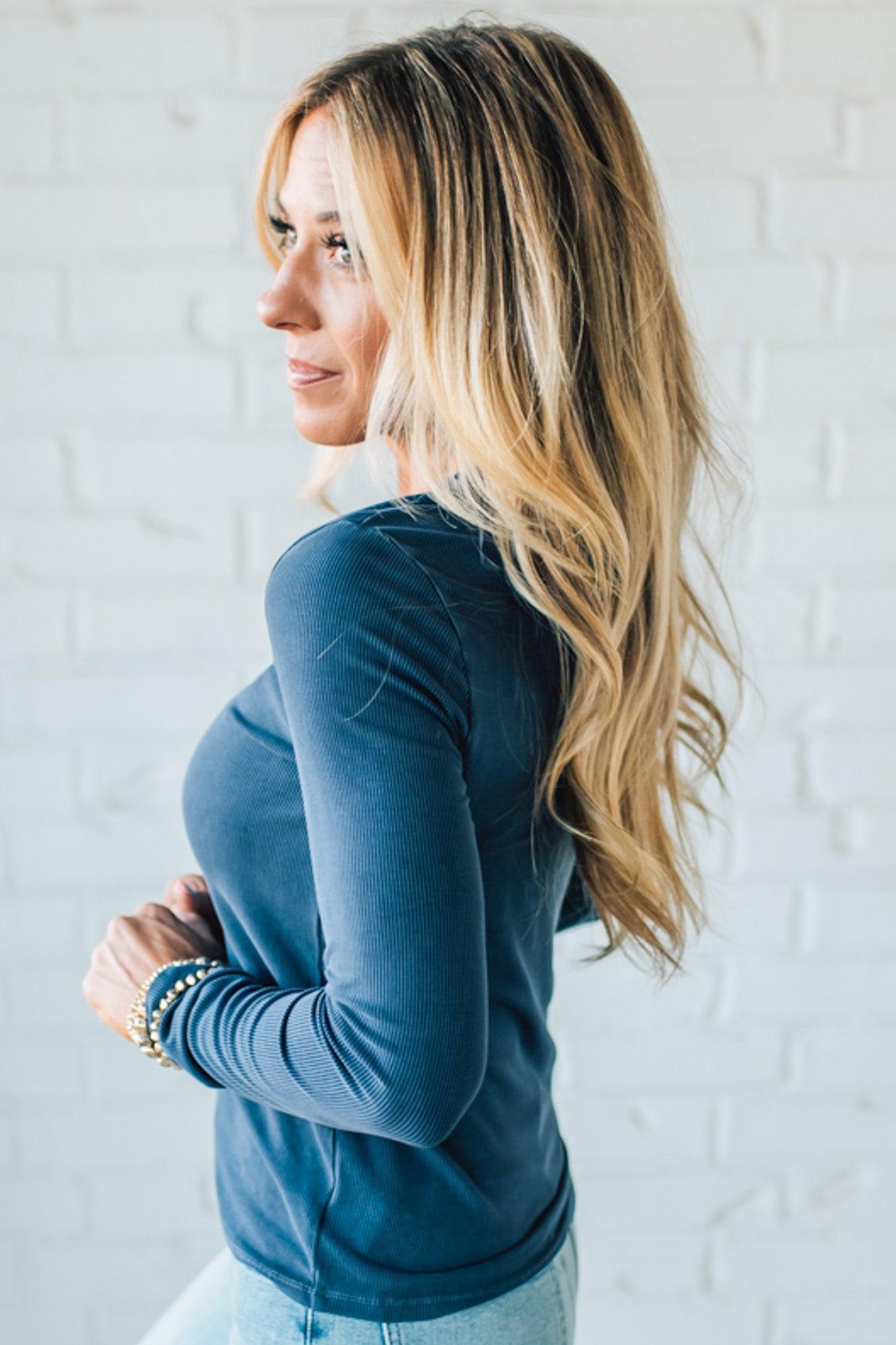 Blonde Woman Wearing A Solid Washed Basic Scoop Neck Ribbed Tee.