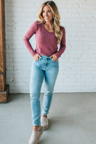 Blonde Woman Wearing A Solid Washed Basic Scoop Neck Ribbed Tee.