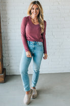 Blonde Woman Wearing A Solid Washed Basic Scoop Neck Ribbed Tee.