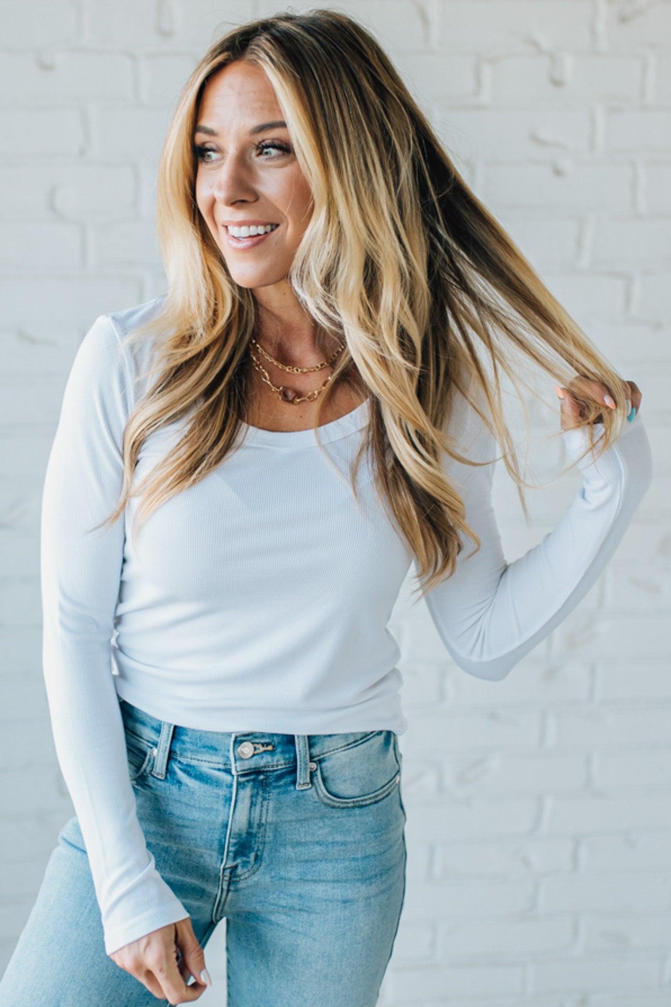 Blonde Woman Wearing A Solid Washed Basic Scoop Neck Ribbed Tee.
