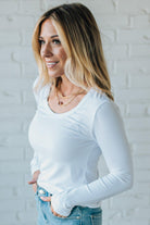 Blonde Woman Wearing A Solid Washed Basic Scoop Neck Ribbed Tee.