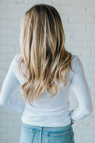 Blonde Woman Wearing A Solid Washed Basic Scoop Neck Ribbed Tee.
