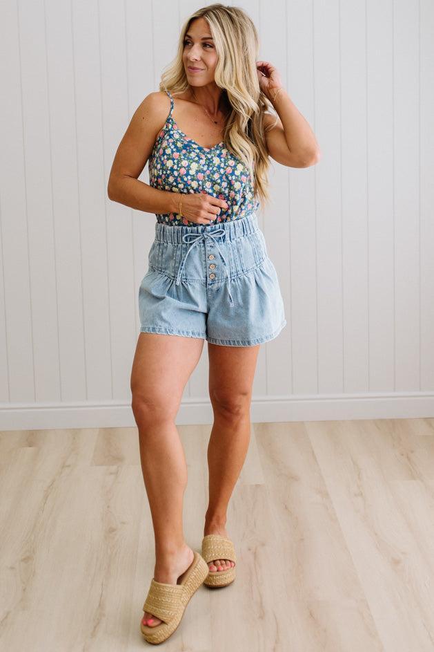 Blonde Woman Wearing a V Neck Floral Printed Tank Top.