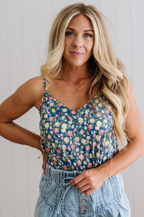 Blonde Woman Wearing a V Neck Floral Printed Tank Top.