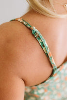 Blonde Woman Wearing a V Neck Floral Printed Tank Top.