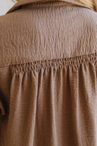 Close-up of a brown textured fabric garment