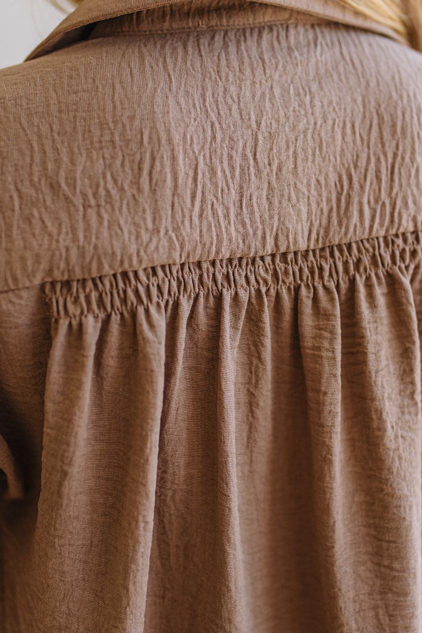 Close-up of a brown textured fabric garment