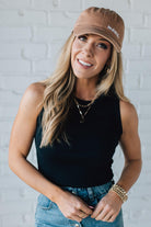 Blonde Woman Wearing a Solid Basic Cotton Garment Dyed Round Neck Tank Top.