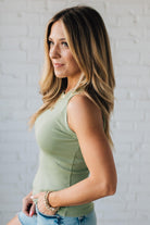 Blonde Woman Wearing a Solid Basic Cotton Garment Dyed Round Neck Tank Top.