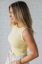 Blonde Woman Wearing a Solid Basic Cotton Garment Dyed Round Neck Tank Top.