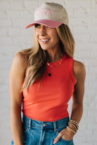 Blonde Woman Wearing a Solid Basic Cotton Garment Dyed Round Neck Tank Top.