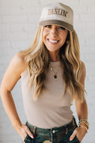 Blonde Woman Wearing a Solid Basic Cotton Garment Dyed Round Neck Tank Top.