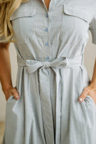 Blonde Woman Wearing a Striped Cotton Button Down Maxi Dress in Light Blue and White Fine Stripes