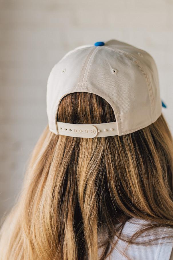 Blonde Woman Wearing a Two Tone Canvas Trucker Hat Baseball Cap.