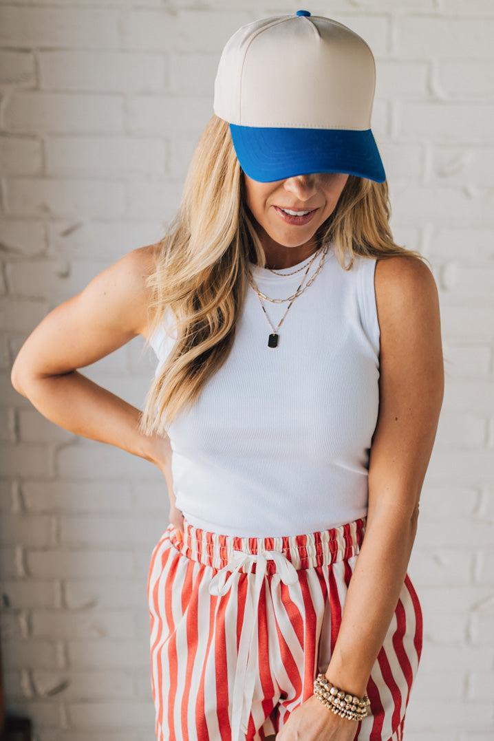 Blonde Woman Wearing a Two Tone Canvas Trucker Hat Baseball Cap.