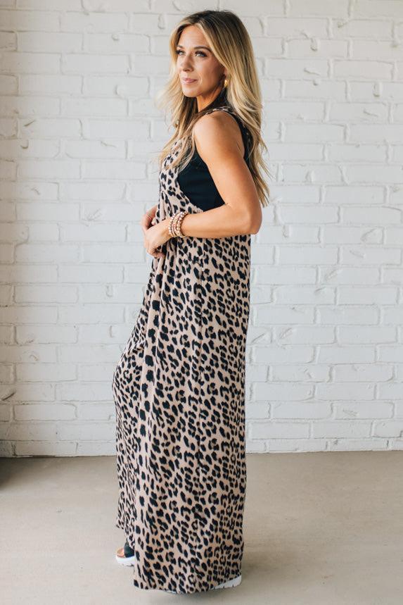 Blonde Woman Wearing Bold Leopard Print Wide Leg Overalls with Side Pockets.