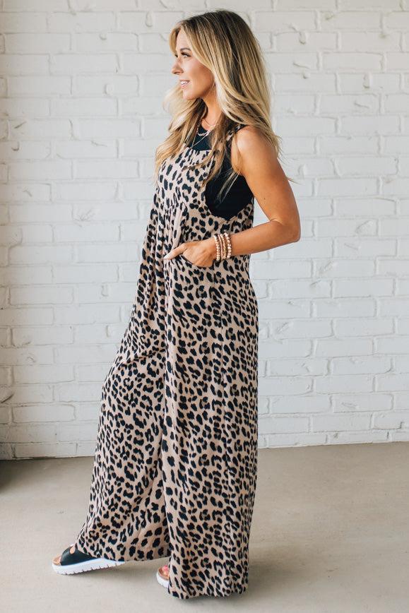 Blonde Woman Wearing Bold Leopard Print Wide Leg Overalls with Side Pockets.