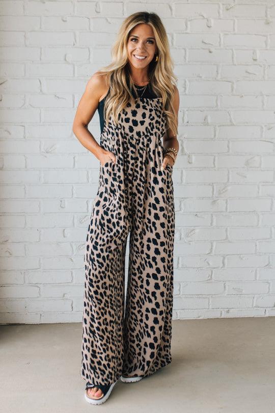 Blonde Woman Wearing Bold Leopard Print Wide Leg Overalls with Side Pockets.