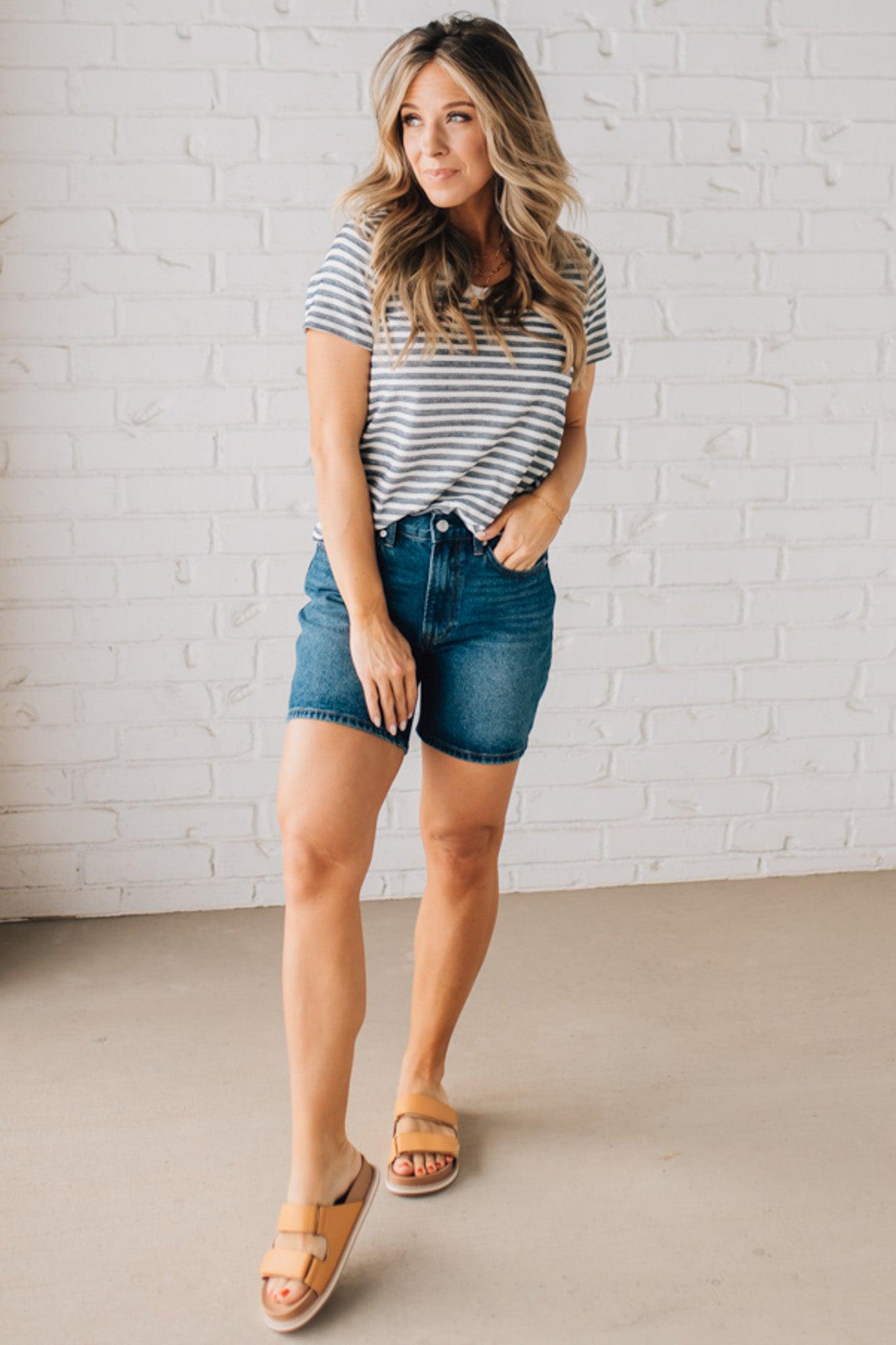 BLONDE WOMAN WEARING A ROUND NECK, SHORT SLEEVE, LOOP TERRY, EVERYDAY LIGHT NAVY STRIPED TOP.