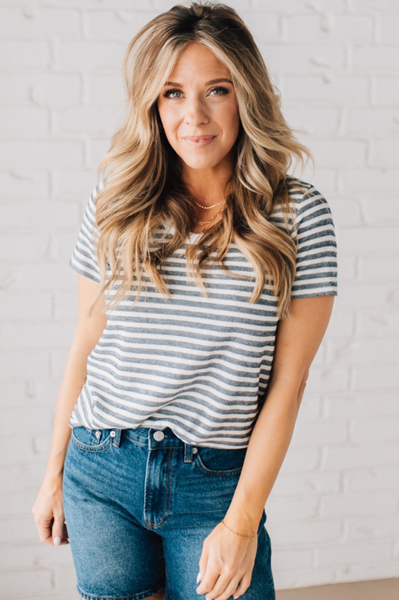 BLONDE WOMAN WEARING A ROUND NECK, SHORT SLEEVE, LOOP TERRY, EVERYDAY LIGHT NAVY STRIPED TOP.