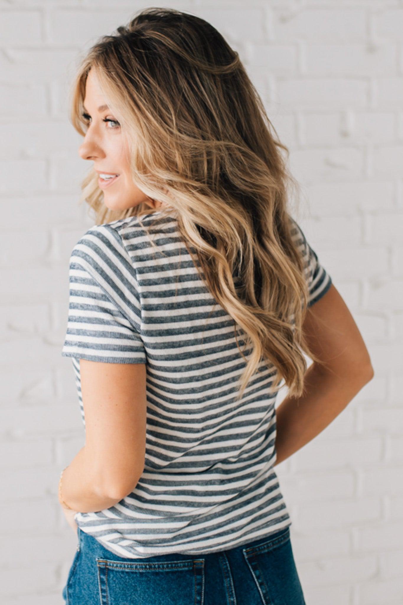 BLONDE WOMAN WEARING A ROUND NECK, SHORT SLEEVE, LOOP TERRY, EVERYDAY LIGHT NAVY STRIPED TOP.