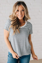 BLONDE WOMAN WEARING A ROUND NECK, SHORT SLEEVE, LOOP TERRY, EVERYDAY LIGHT NAVY STRIPED TOP.