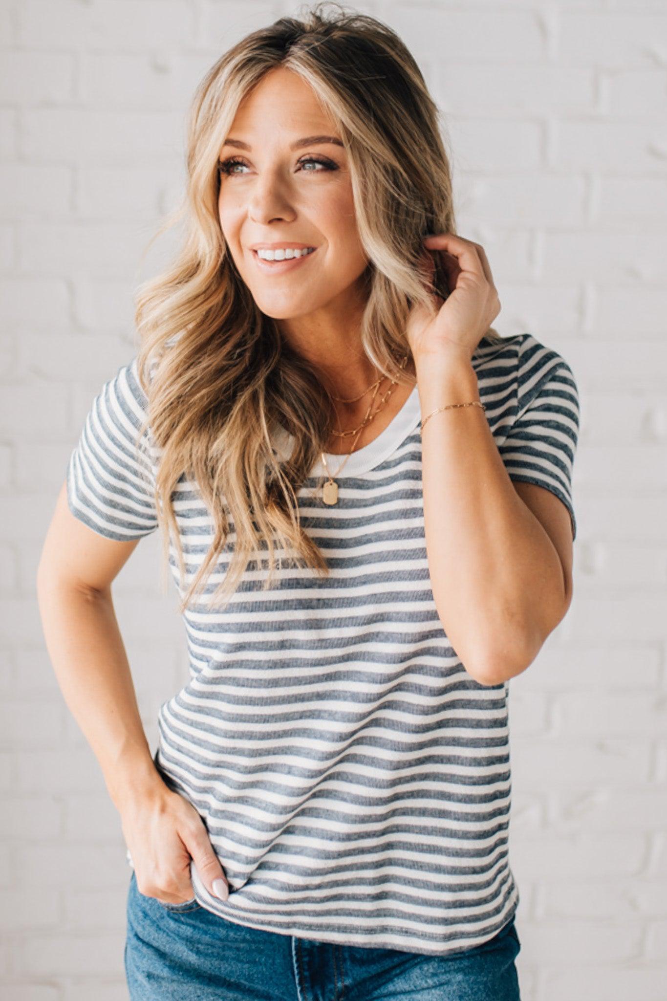 BLONDE WOMAN WEARING A ROUND NECK, SHORT SLEEVE, LOOP TERRY, EVERYDAY LIGHT NAVY STRIPED TOP.