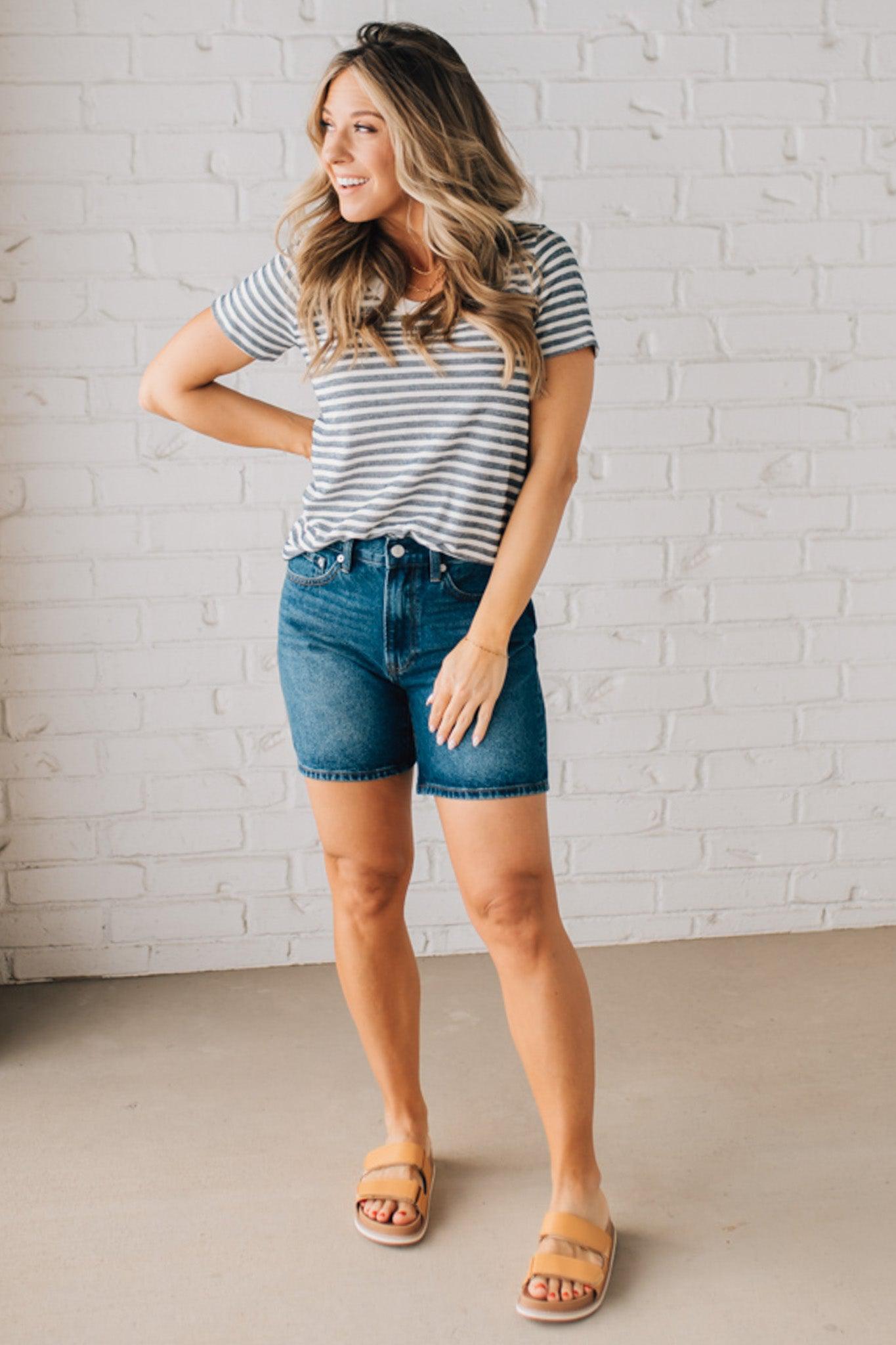 BLONDE WOMAN WEARING A ROUND NECK, SHORT SLEEVE, LOOP TERRY, EVERYDAY LIGHT NAVY STRIPED TOP.