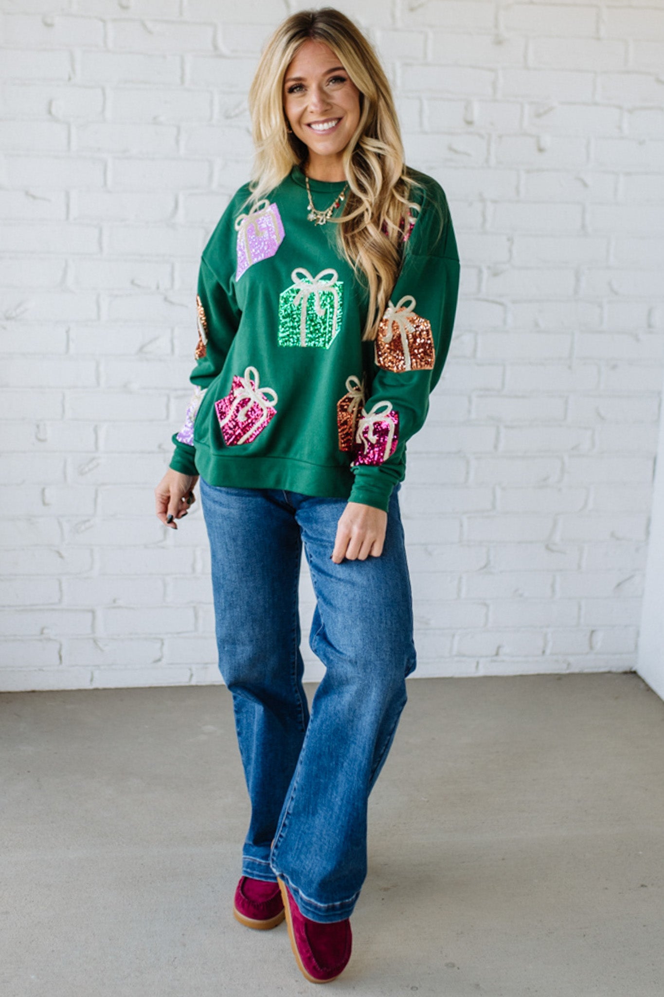 Blonde Woman Wearing a Sequin Christmas Gift Box Embroidered Pullover