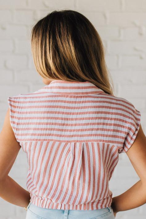Blonde Woman Wearing a Button Front Faded Red and White Striped Cotton Gauze Front Tie Shirt.