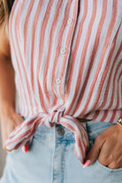 Blonde Woman Wearing a Button Front Faded Red and White Striped Cotton Gauze Front Tie Shirt.