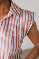 Blonde Woman Wearing a Button Front Faded Red and White Striped Cotton Gauze Front Tie Shirt.