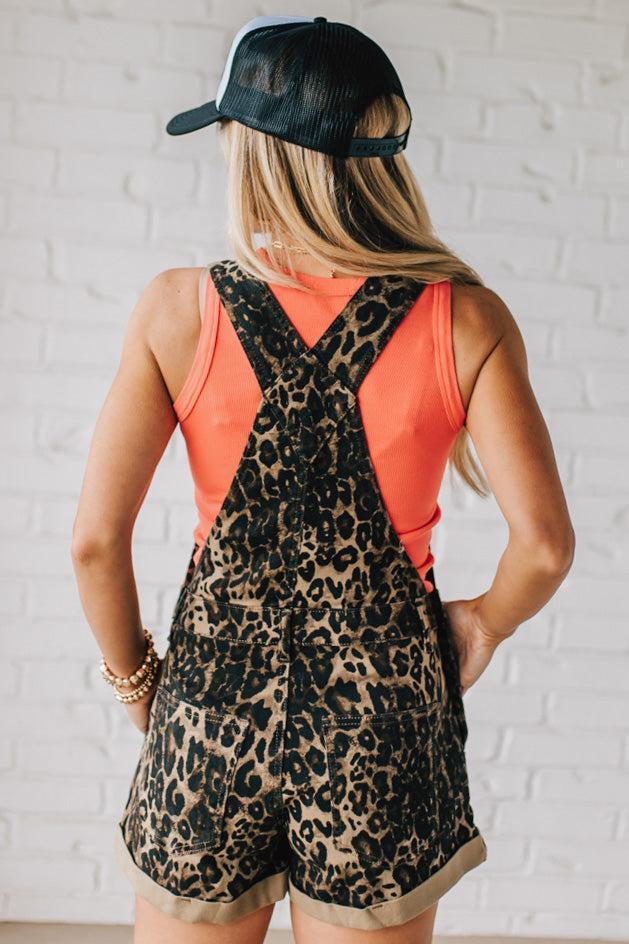 Blonde woman wearing Stretch Leopard Printed Denim Overall Shorts.