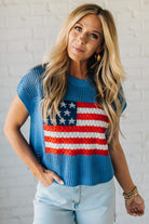 Blonde Woman Wearing a Cobalt Blue Mesh Weave American Flag Open Stitch Sweater Top.