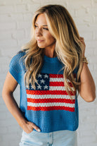 Blonde Woman Wearing a Cobalt Blue Mesh Weave American Flag Open Stitch Sweater Top.