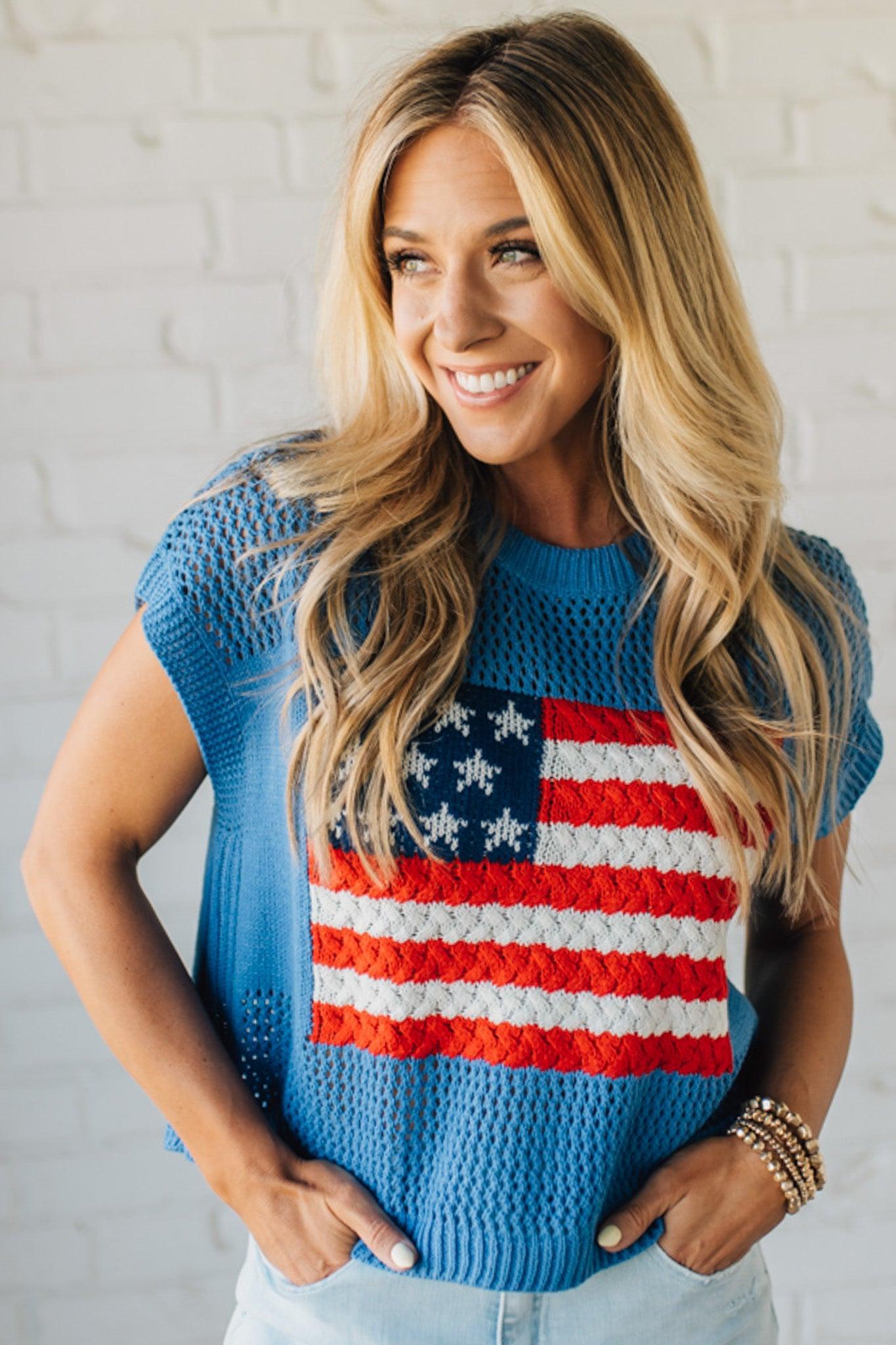 Blonde Woman Wearing a Cobalt Blue Mesh Weave American Flag Open Stitch Sweater Top.