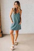 Blonde woman wearing a Mini Dress With Built-in Romper Liner.