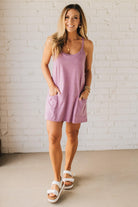Blonde woman wearing a Mini Dress With Built-in Romper Liner.