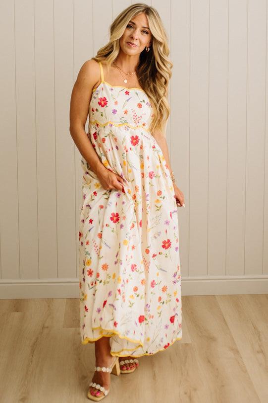 Woman wearing a floral dress with a white background