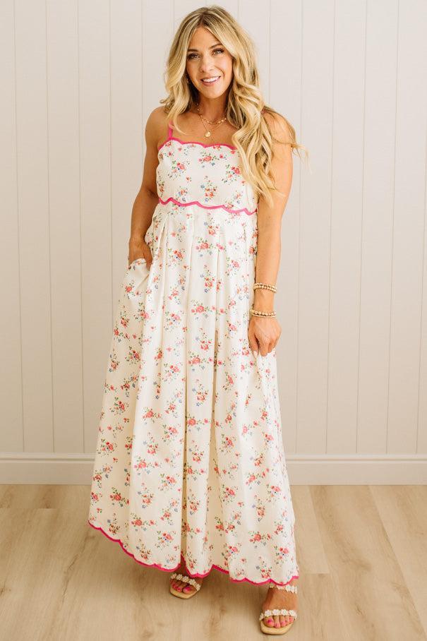 Woman wearing a floral dress with a white background