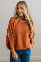 BLONDE WOMAN WEARING DARK JEANS IN A BRIGHTLY LIT STUDIO WITH A SOLID SWEATER FEATURING SCALLOP TRIM AND BUTTONS UP THE SLEEVE IN THE COLOR HEATHERED RUST.