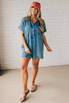 BLONDE WOMAN WEARING A TENCEL MINERAL WASHED HALF BUTTON SHIRTS ROMPER WITH POCKETS.