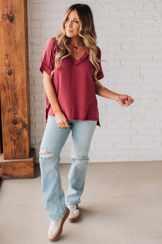 women modeling a burgundy short sleeve corded v neck top