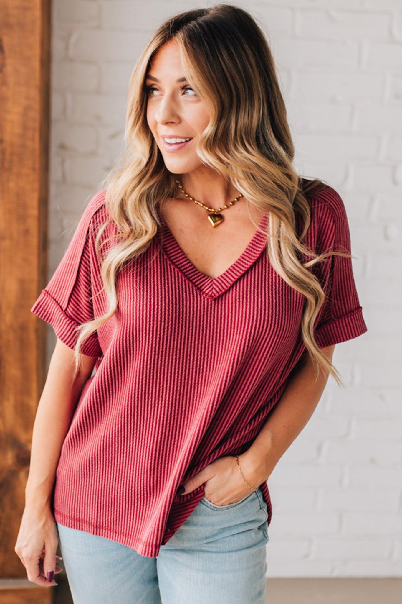 women modeling a burgundy short sleeve corded v neck top