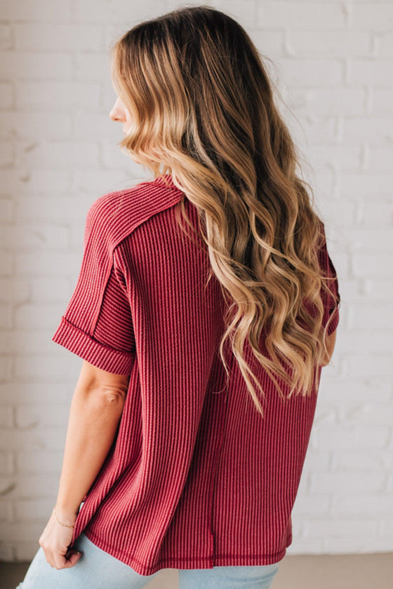 women modeling a burgundy short sleeve corded v neck top