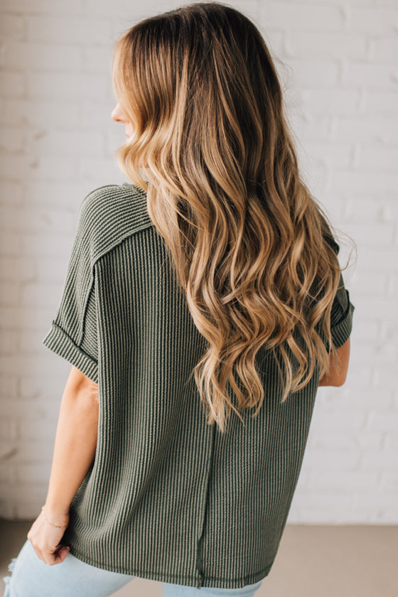 women modeling a olive short sleeve corded v neck top