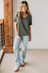 women modeling a olive short sleeve corded v neck top