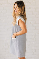 Blonde Woman Wearing a Drop cap sleeves tiny checker print shift dress with pocket, solid contrast accent.
